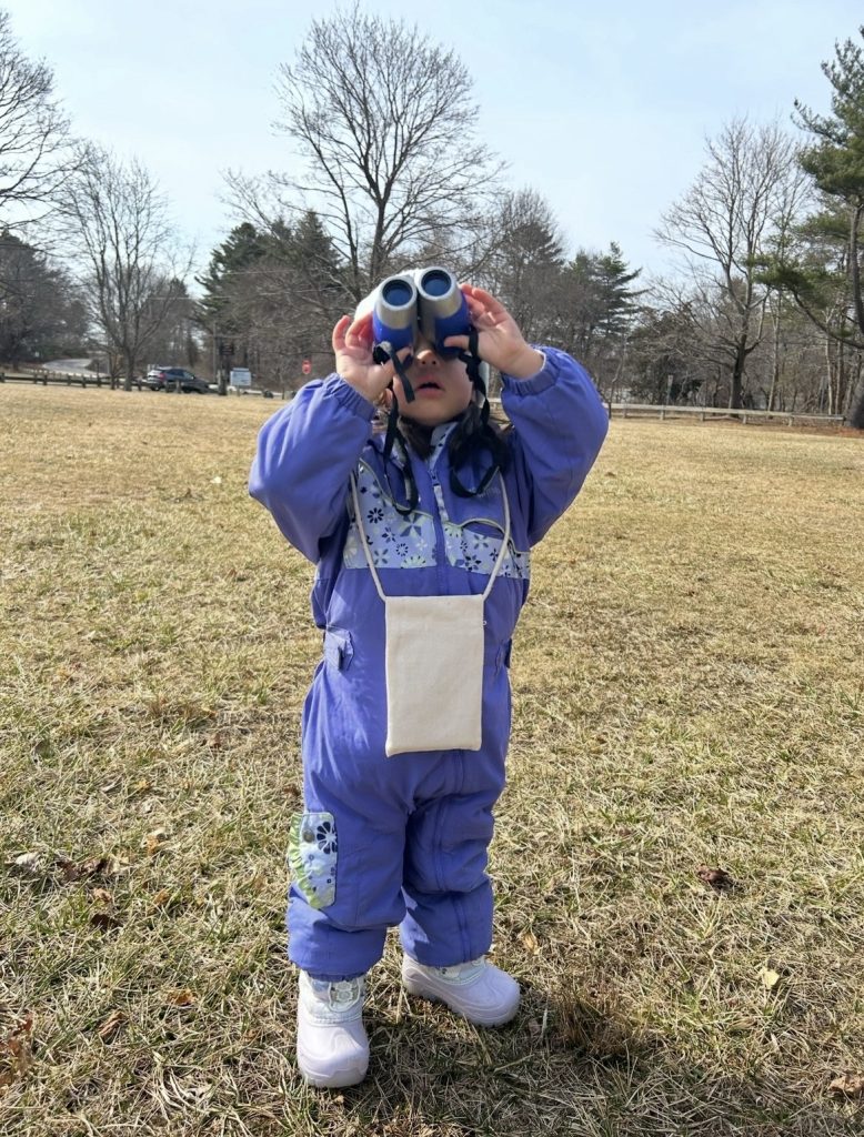 Ada Murdough using binoculars