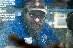SSC Lead Aquarist Sam Rutka looks in on tank